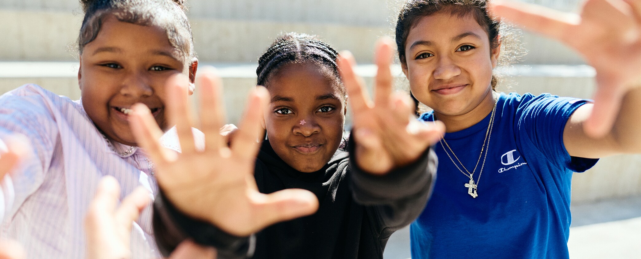 Students waving