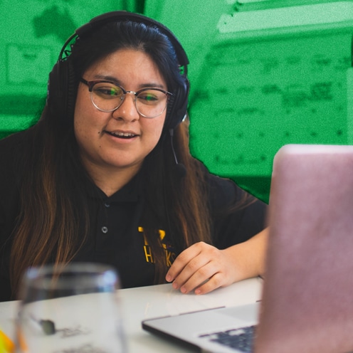 Teacher in front of laptop for remote learning