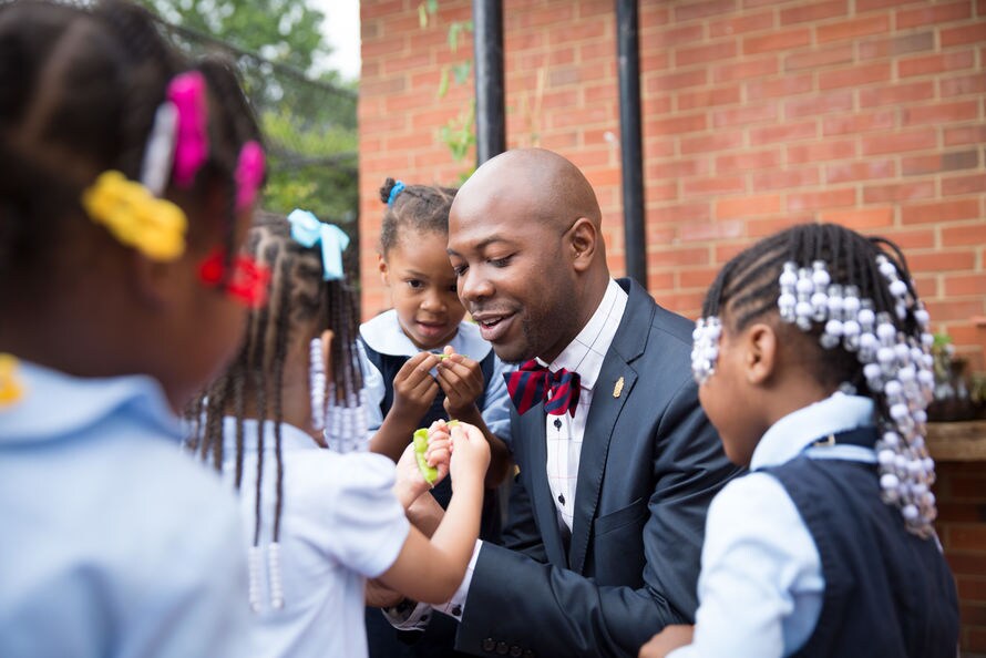 Corps member with children.