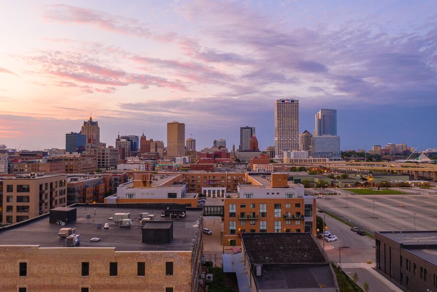 Alt text: the Milwaukee skyline at sunset