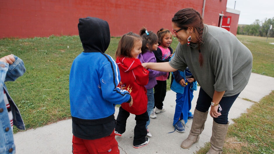 Teach For America alumna, Mia Francis (South Dakota '14) greets her kindergarteners at He-Dog Elementary in Parmelee on the Rosebud Reservation in South Dakota.
