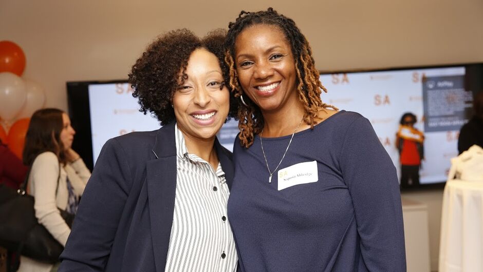 Two members of the Military Veterans Initiative posing for a photo.