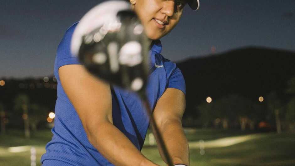 Maya Reddy swinging the golf club toward the camera
