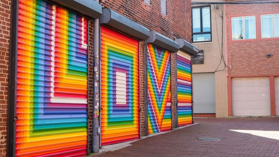 A mural reads LOVE in rainbow colors.
