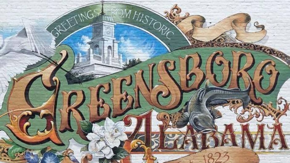 A mural on a building reads Greensboro, ALabama