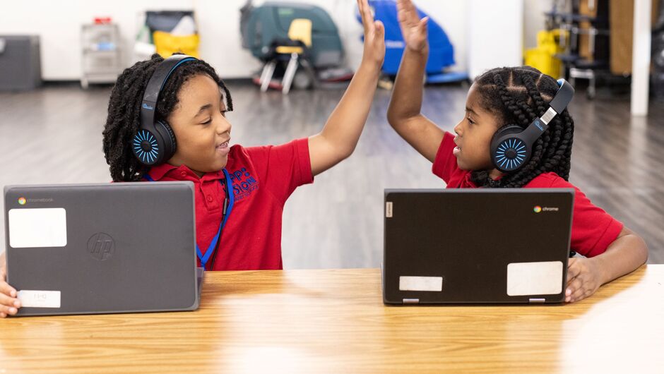 Students giving each other a high five