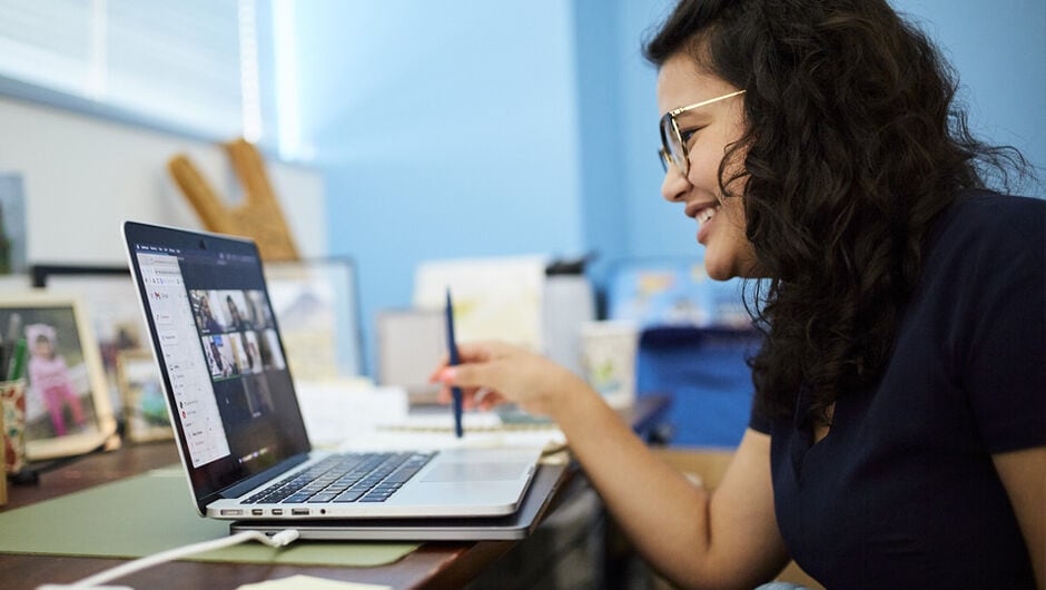 Alt text: Fellow talking with students.