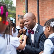 Corps member with children.