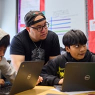 Teacher Helping Students