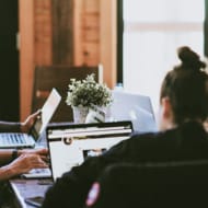 A group of young people working at a coffee shop.