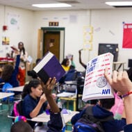 Students holding books